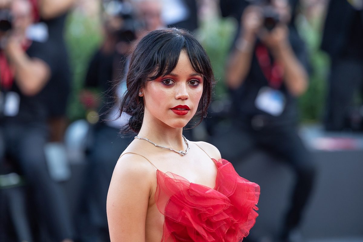 Jenna Ortega in a red ruffled gown at the 2024 Venice Film Festival — file photo, not her gold Torlowei gown from the 2026 Klara and the Sun premiere