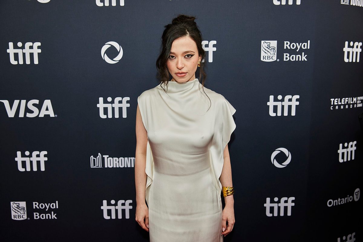 Mikey Madison in an ivory draped satin dress at the 2024 Toronto International Film Festival (file photo, not the 2026 Social Reckoning gowns)